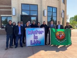 tribal supporters stand in front of the US District Court, September 2019