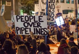 Protest sign: People Over Pipelines